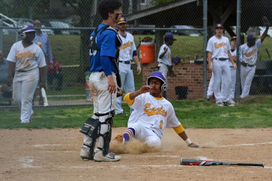 Mathon sliding into home base, showing off his toughest baseball skills.