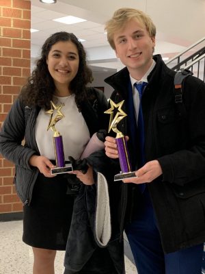 Maya smiling with Jonas Wall (10) at a debate tournament after winning first place. 
