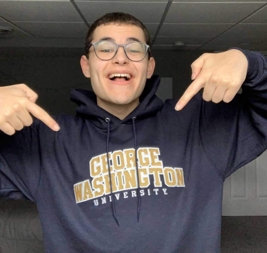 Ben Haug points at his George Washington University hoodie.