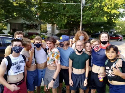 A group of smiling Webster Groves High School boys show their support to the cause by wearing their most revealing belly shirts.