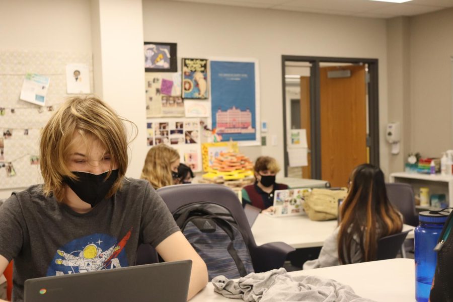 Students properly adhering to Brentwoods mask mandates during their english class.