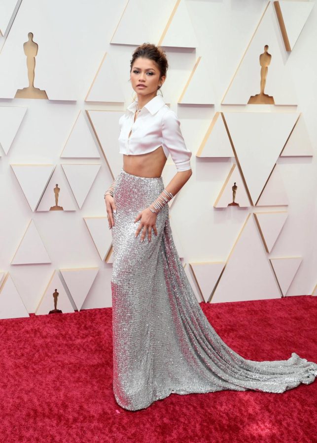 Zendaya arrived to the Oscars in a cropped Valentino, button up, silk blouse paired with a long silver sequined skirt that trailed behind her.
Photo: Getty Images