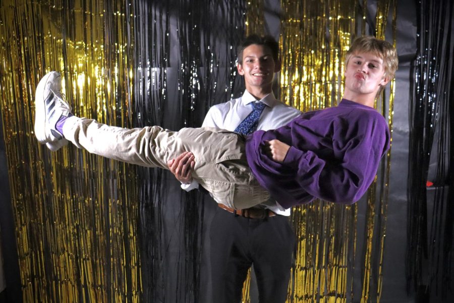 Miller Chantharasy (11) holds Carter Bowman (11) as he makes a goofy face for the camera at the homecoming dance.