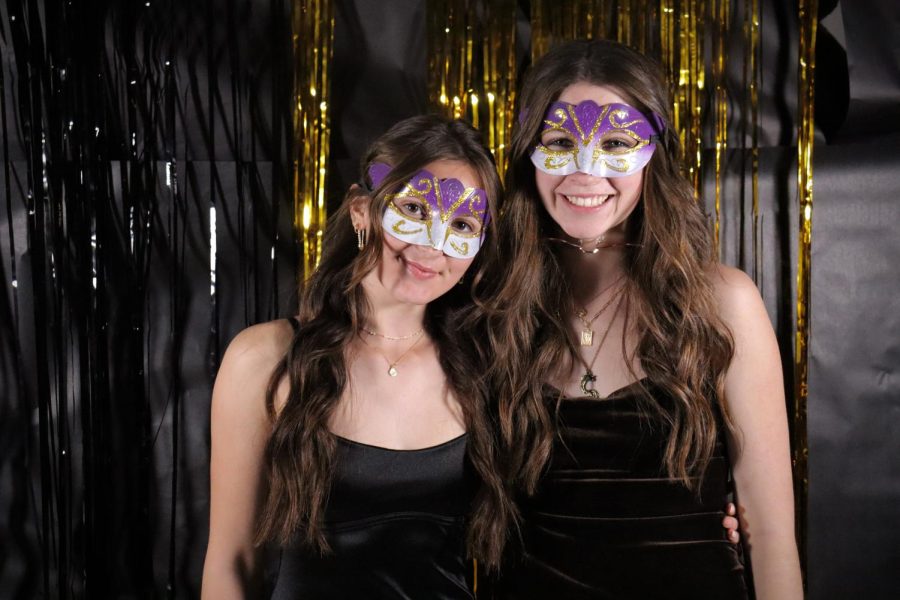 Seniors Amelia Van Uum and Gabby Batchen wear matching masks to be on theme for the dance!