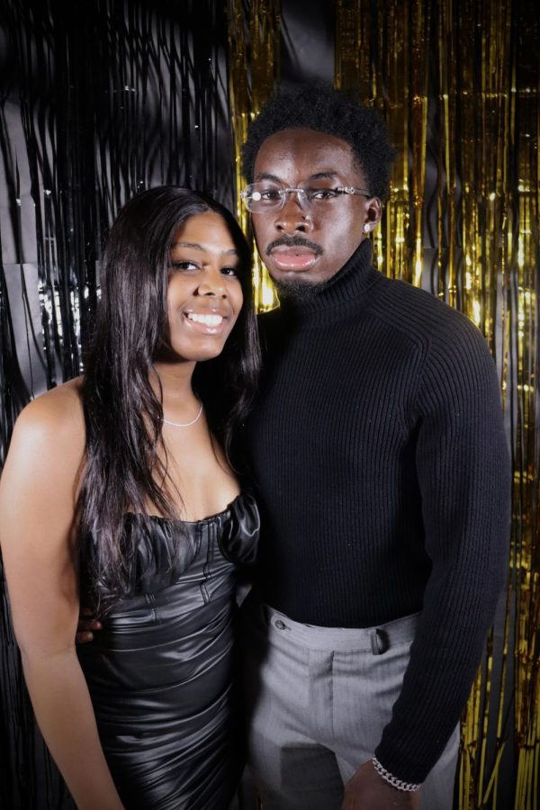 Nick Phillips (12) and his date Kamari Mace (11) professionally pose for their couple picture!