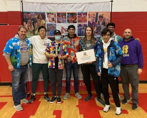 Members of 7525 pose with their Winning Alliance trophy.