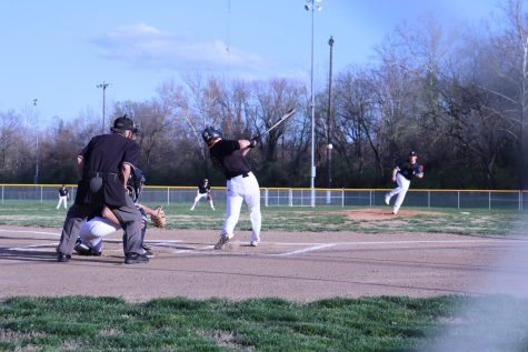 hits the ball from the Maplewood pitcher.