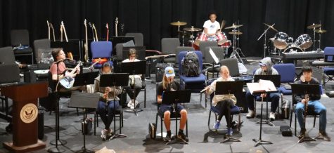 Krener playing with the 8th-grade band class.