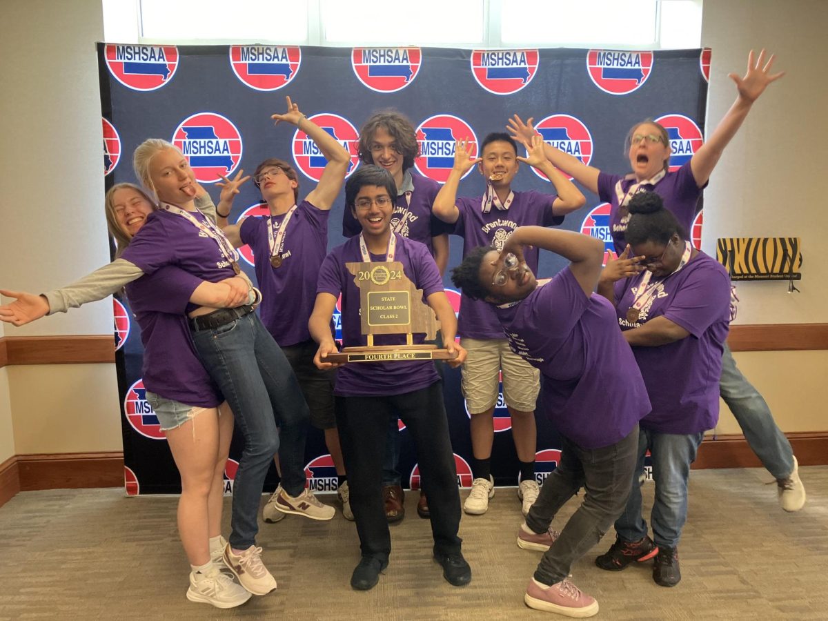 The Scholar Bowl team poses with their 4th place trophy that they earned at the MSHSAA state tournament held in Columbia, MO, on May 3rd! From left to right, Jess Fallon (10), Kellie Mcgee (11), Michael Ventimiglia (10), Mark Butler (12), Rohan Dixit (10), Alex Tung (10), Alus Jones (11), Luc Jones (11) and Ms. Musterman. 