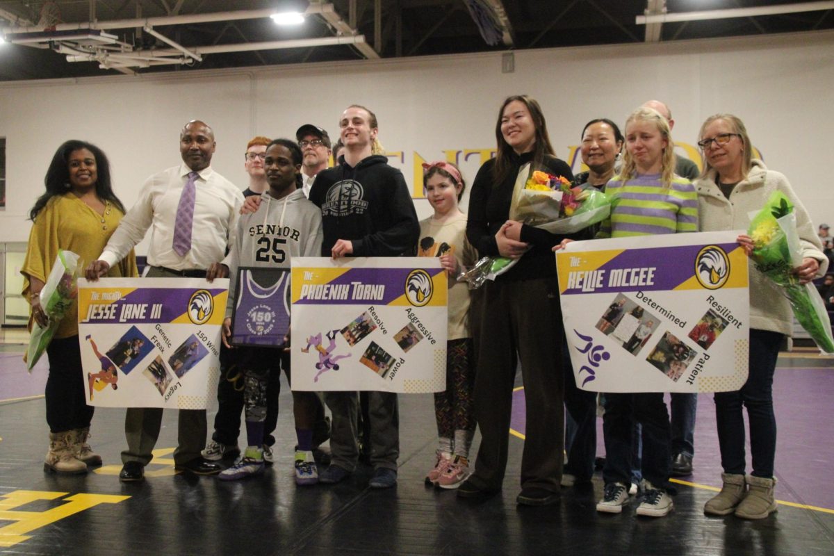 All of the seniors pose for a pic with their families during senior night.