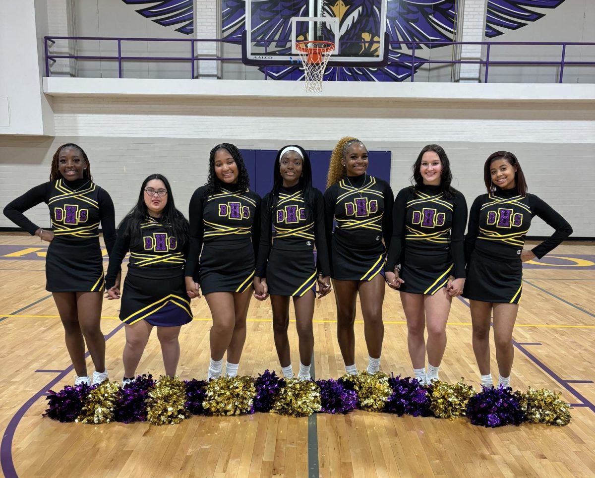 The senior cheerleaders pose for a group picture on media day.